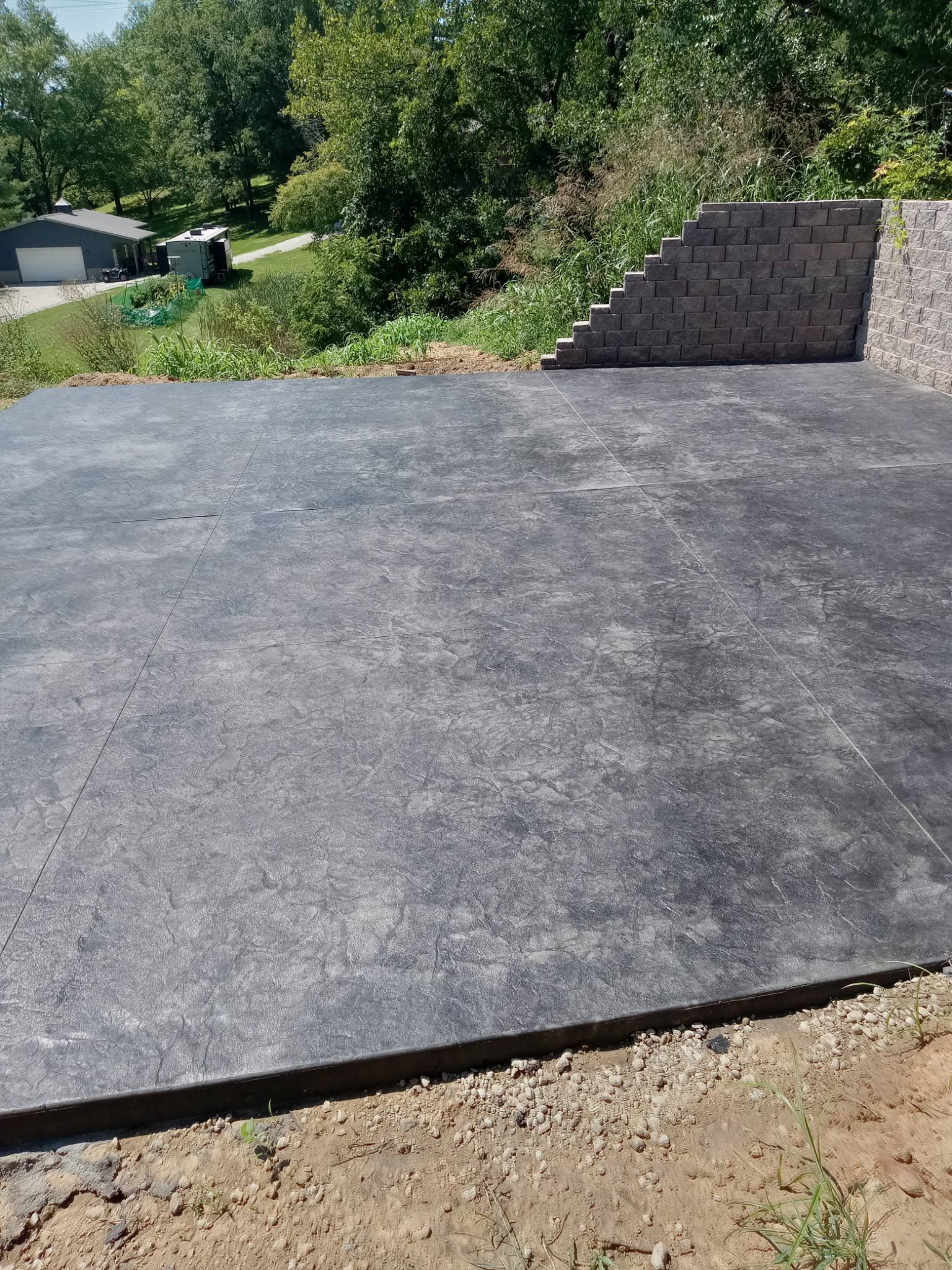 Stamped slate-pattern concrete overlay patio