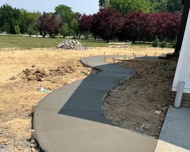 S-curve concrete walkway alongside a house