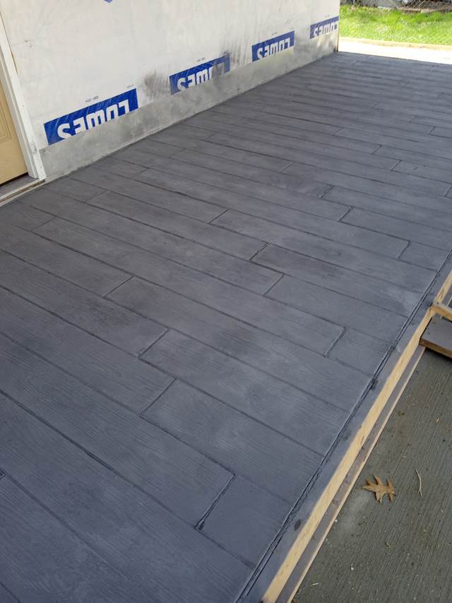 Wood-plank stamped concrete patio, charcoal finish