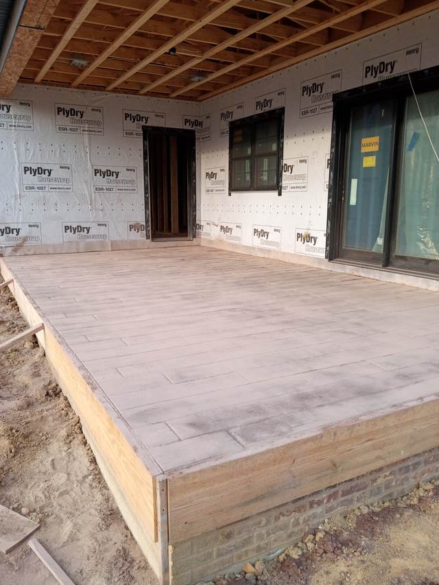 Wood-plank stamped concrete covered porch, tan finish